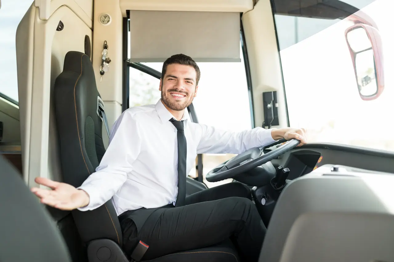 A driver welcoming passengers on board